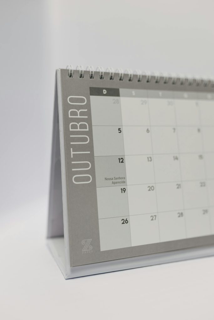 A simple and clean design of an October desk calendar with spiral binding.