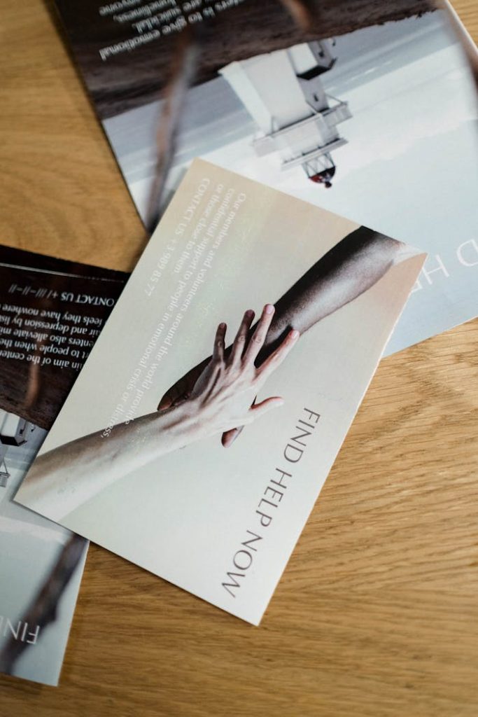 pexels photo 8526705 Brochures on seeking mental health support with helping hands imagery.